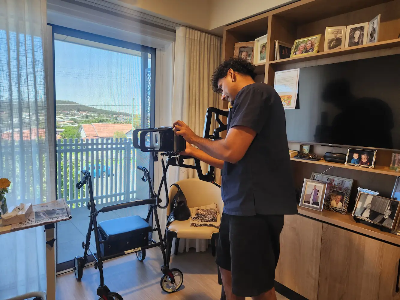 Modia Health radiographer performing a portable X-ray in a patient's home